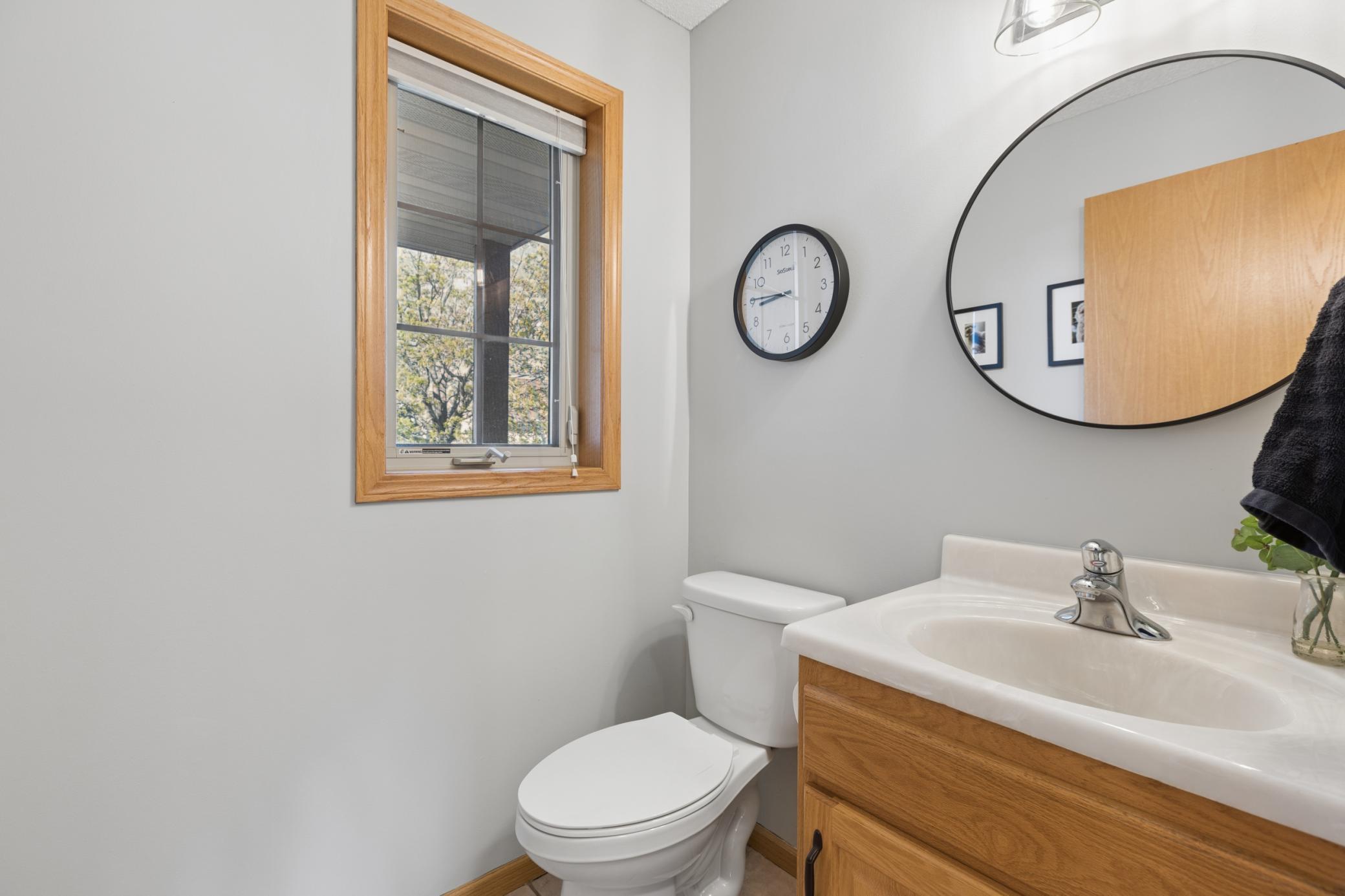 Main floor 1/2 bath with neutral paint .. perfect for guest use when you have company