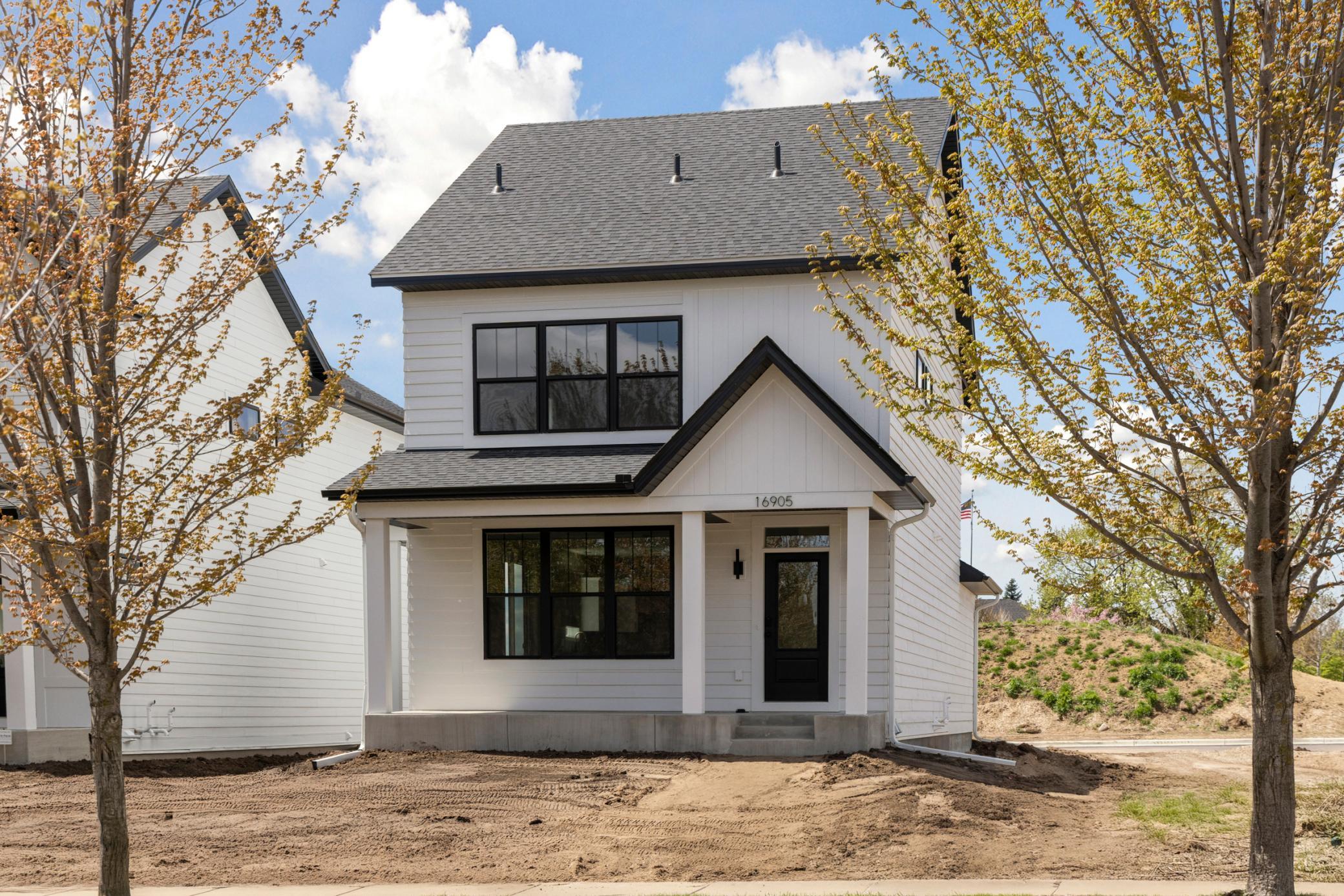 Modern farmhouse design combined with coveted maintenance free lifestyle.