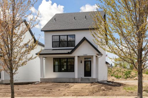 Modern farmhouse design combined with coveted maintenance free lifestyle.