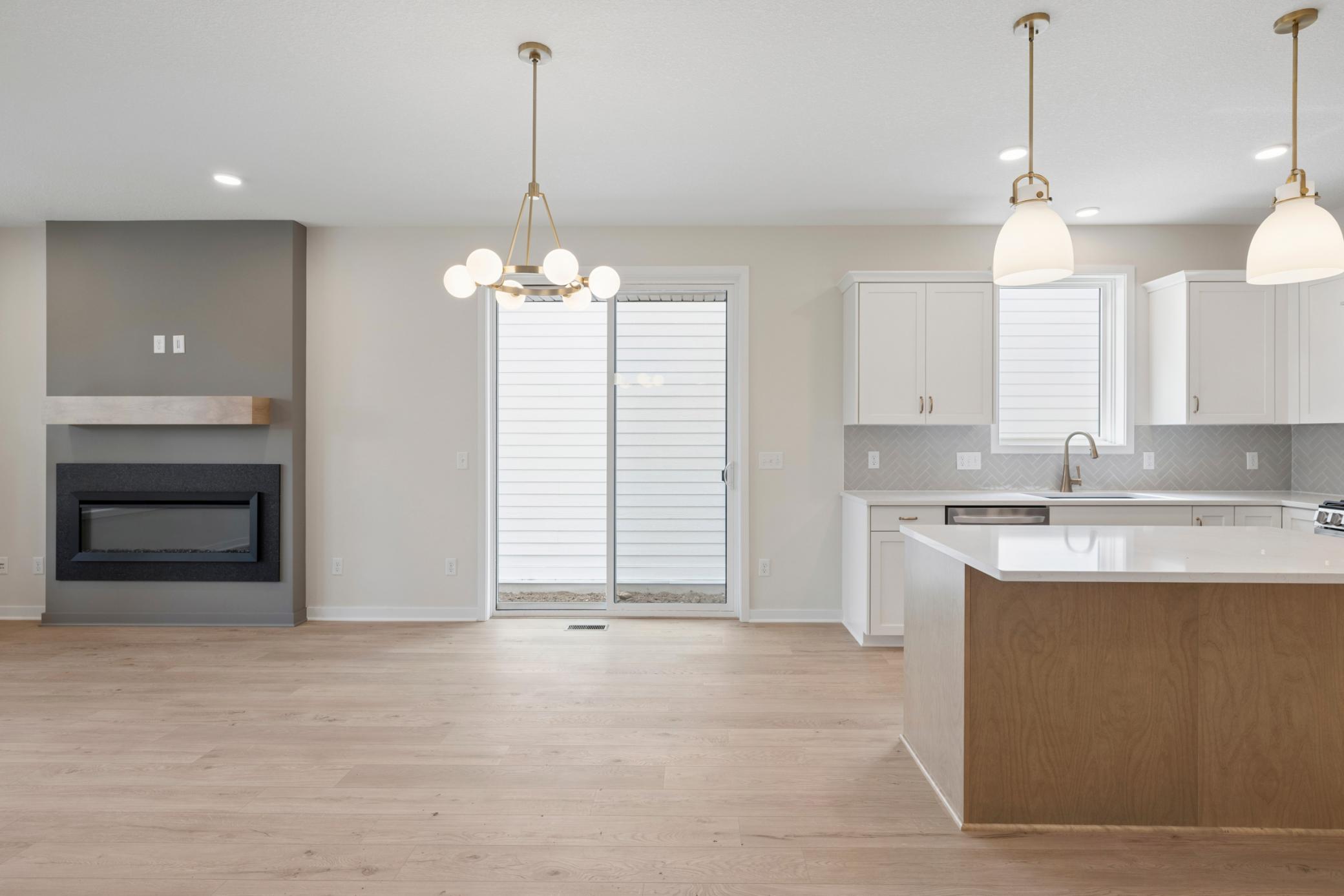 Dining walks out to patio and private side yard with fence.