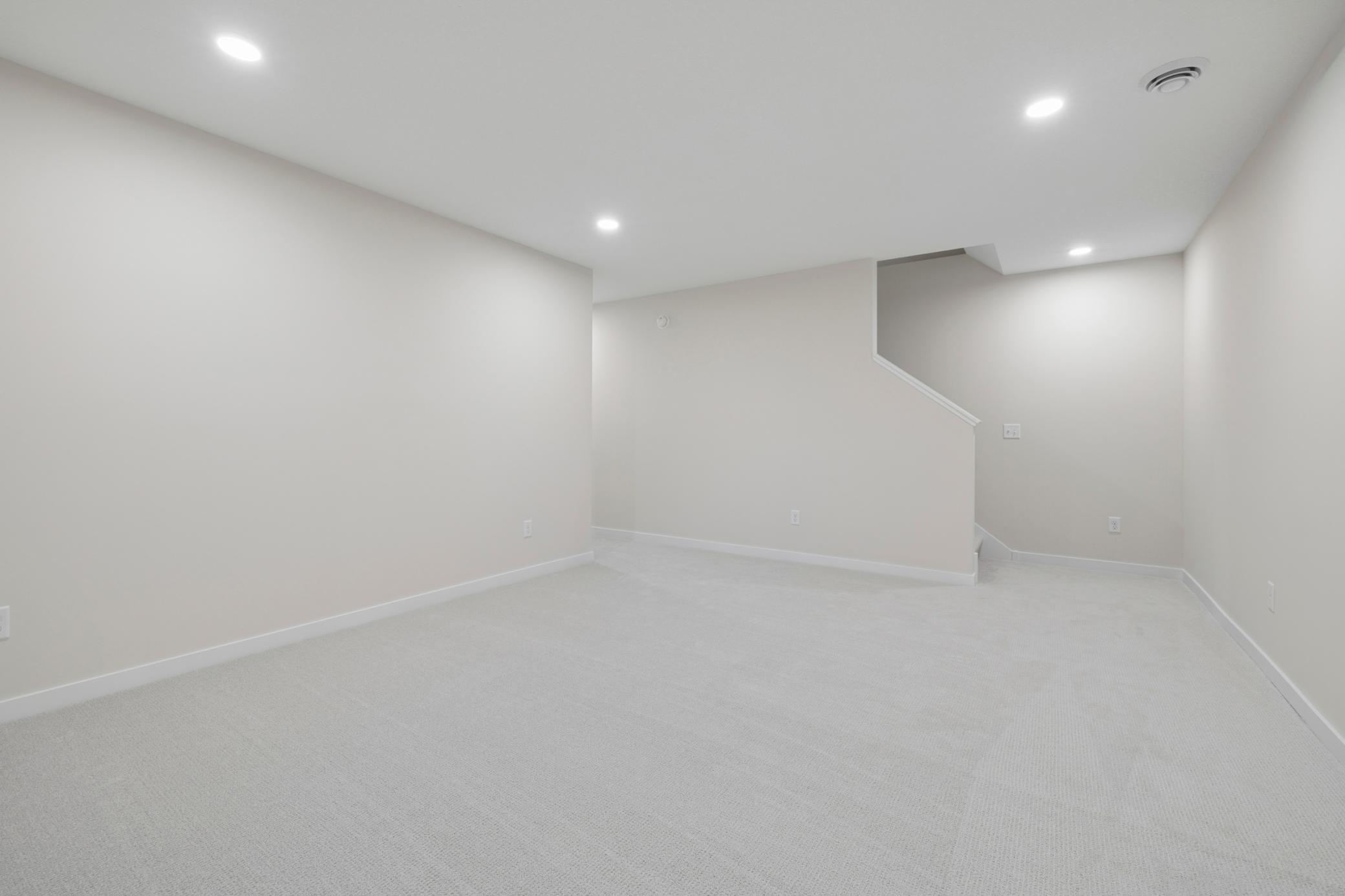 The finished lower level is an expanded entertaining space with family room, 4th bedroom and additional bathroom.