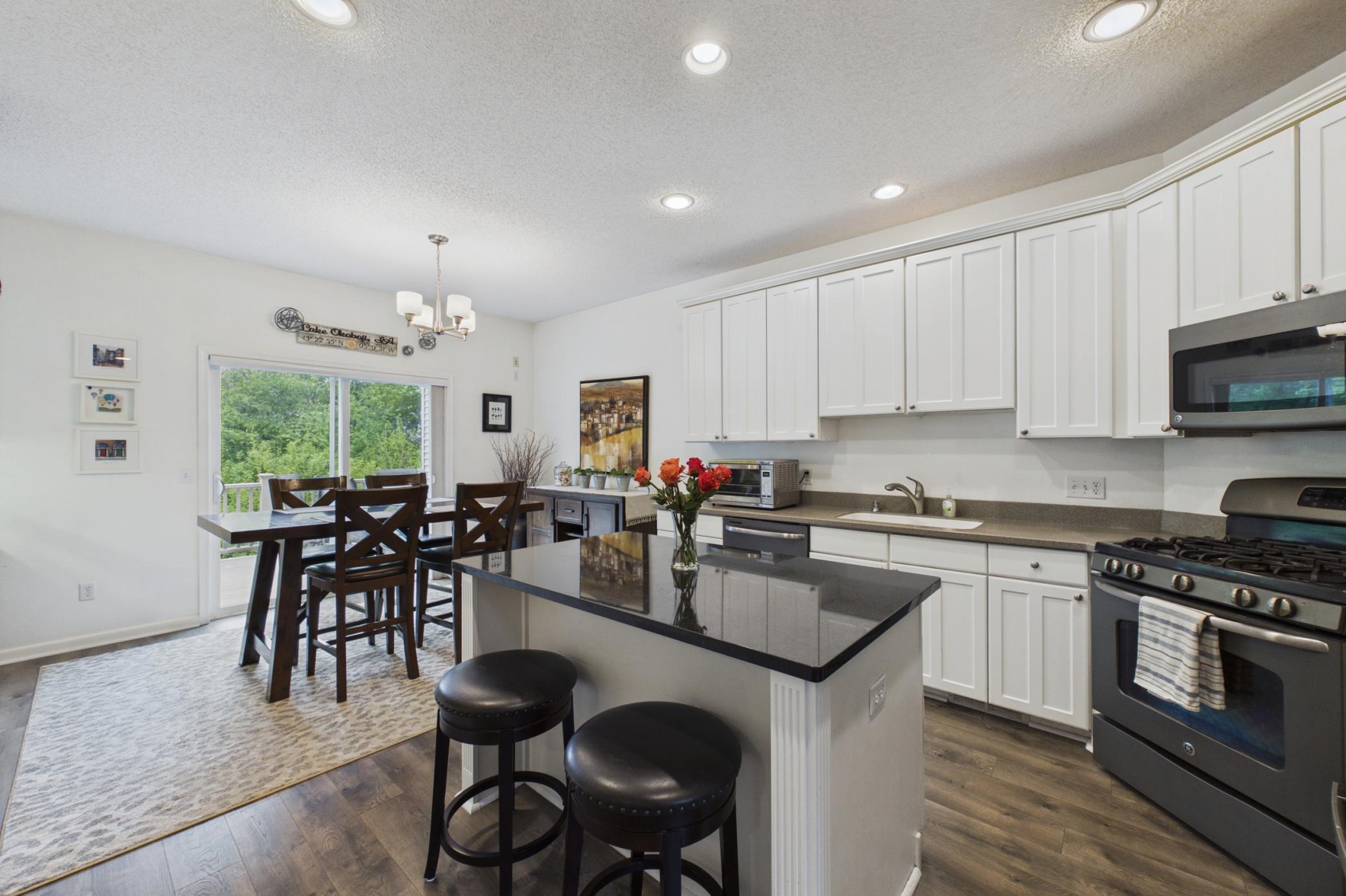 Center island kitchen with door to deck