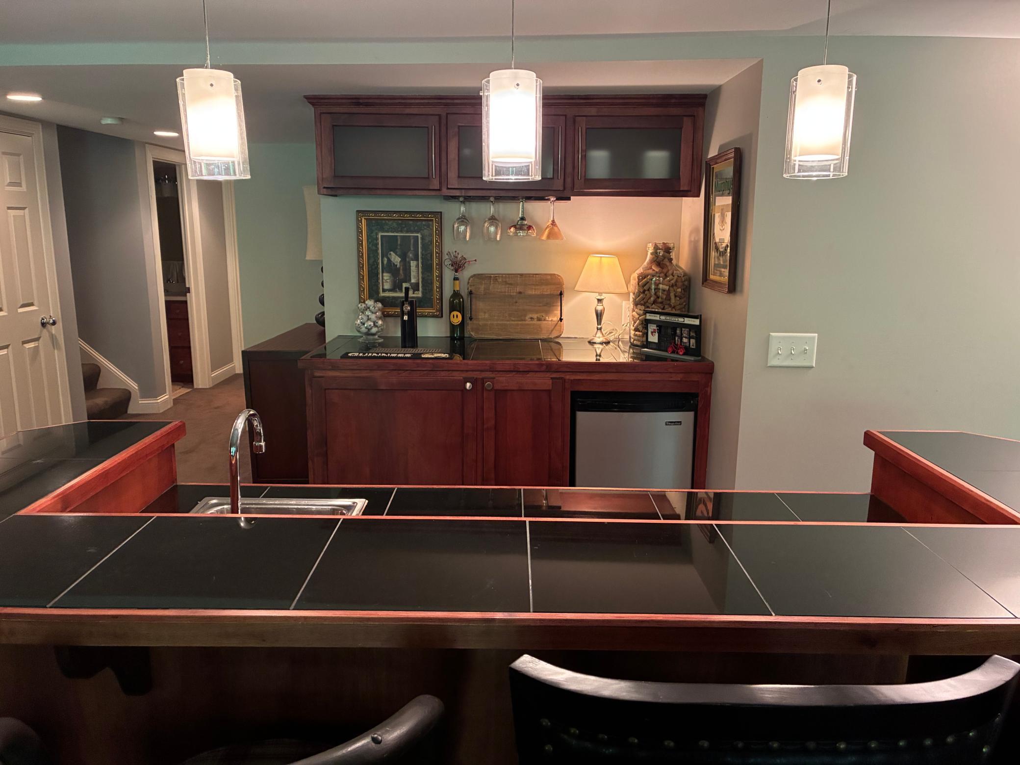 Wet bar with sink and fridge-lower level