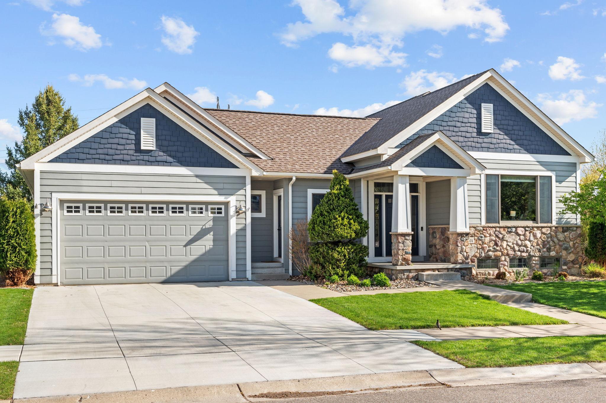 Rare 3 stall tandem garage and inviting front exterior in Towne Lakes.