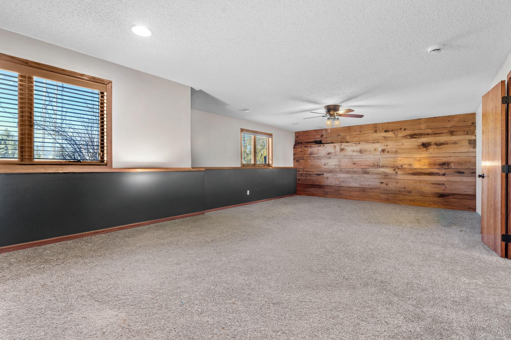 Huge lower level family room with flexible space for entertaining, fitness, or hobbies.