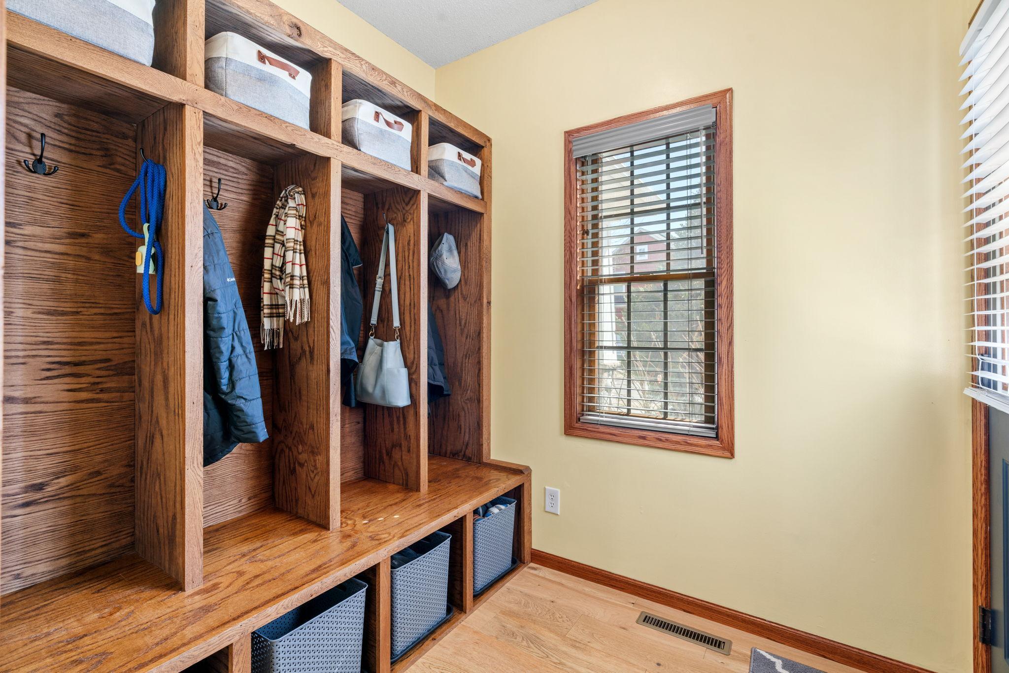Functional mudroom entry with custom built in storage and organization.