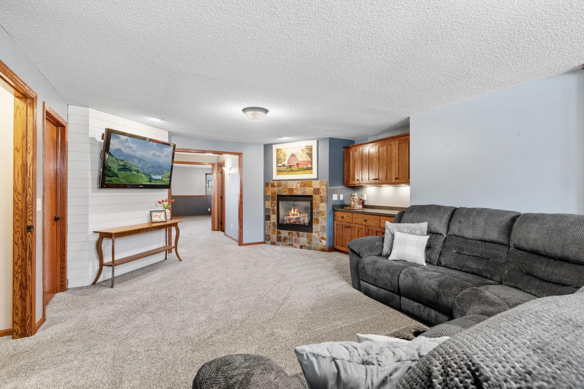 Additional lower level living space with cozy fireplace and room to spread out.