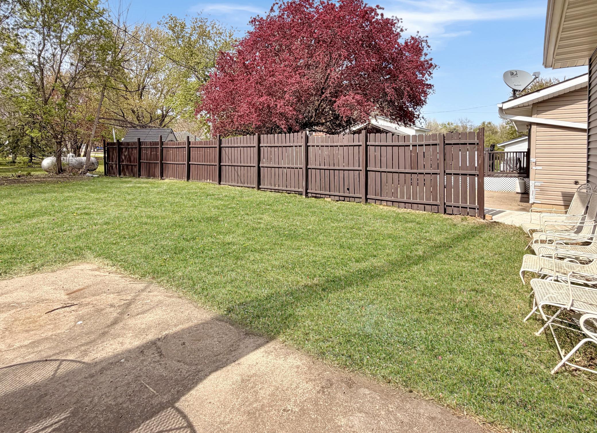 Partial privacy fence bordering the neighbor's yard