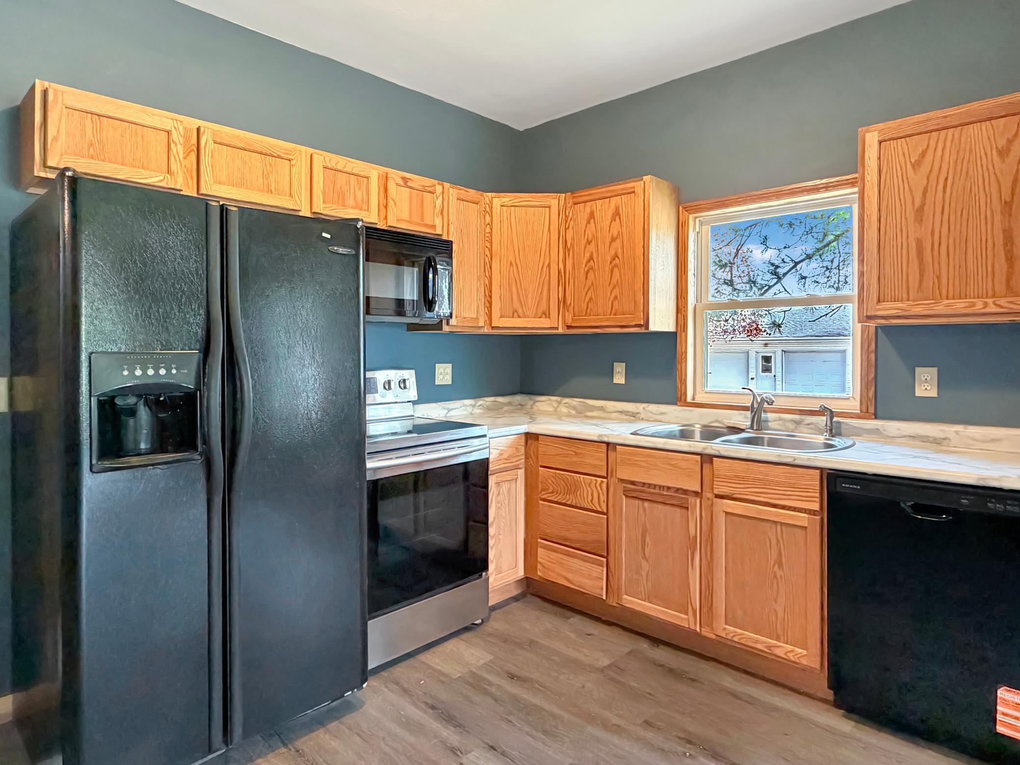 Beautiful oak cabinets and updated countertop make for a great work space