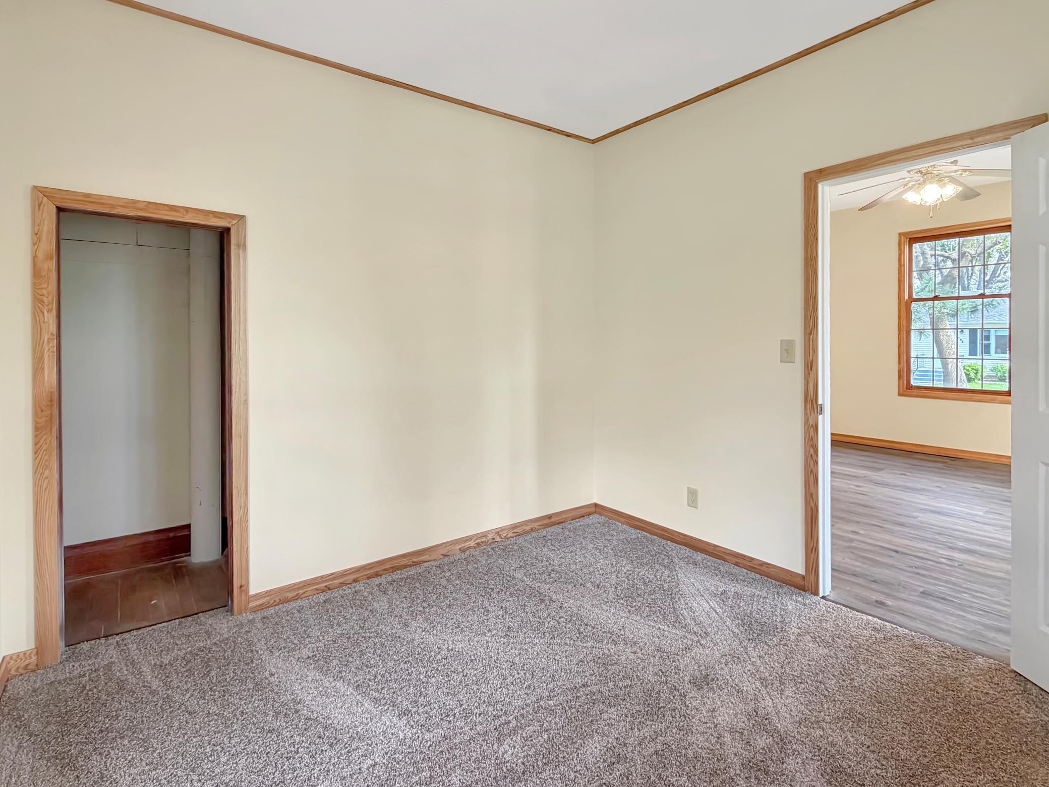 Main floor bedroom with carpet