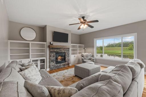 Beautiful living room with backyard views of pond
