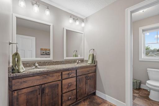 Guest bathroom with privacy door to shower and bathroom on the back right