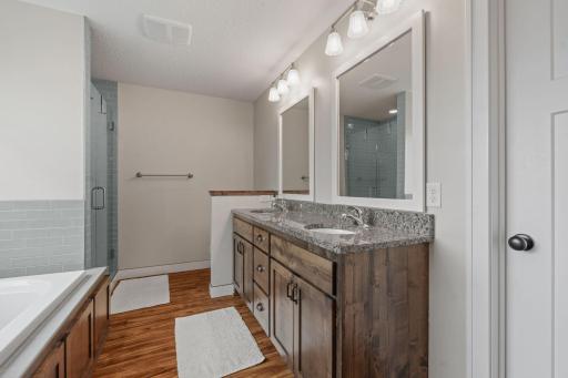 Primary En Suite with peek of walk in closet door on right