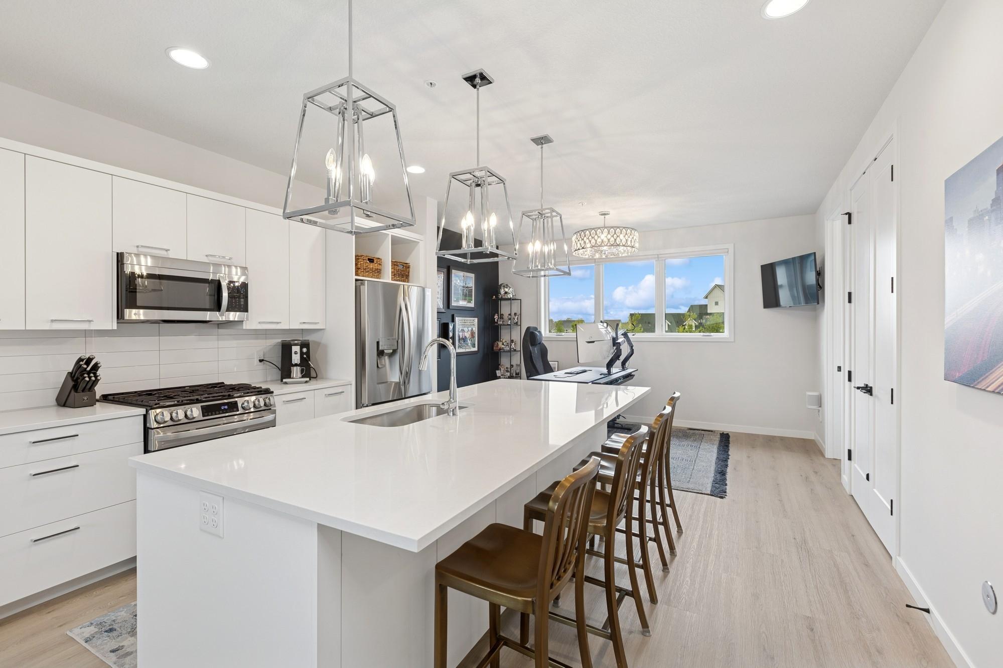 Sleek kitchen with solid surface counter tops