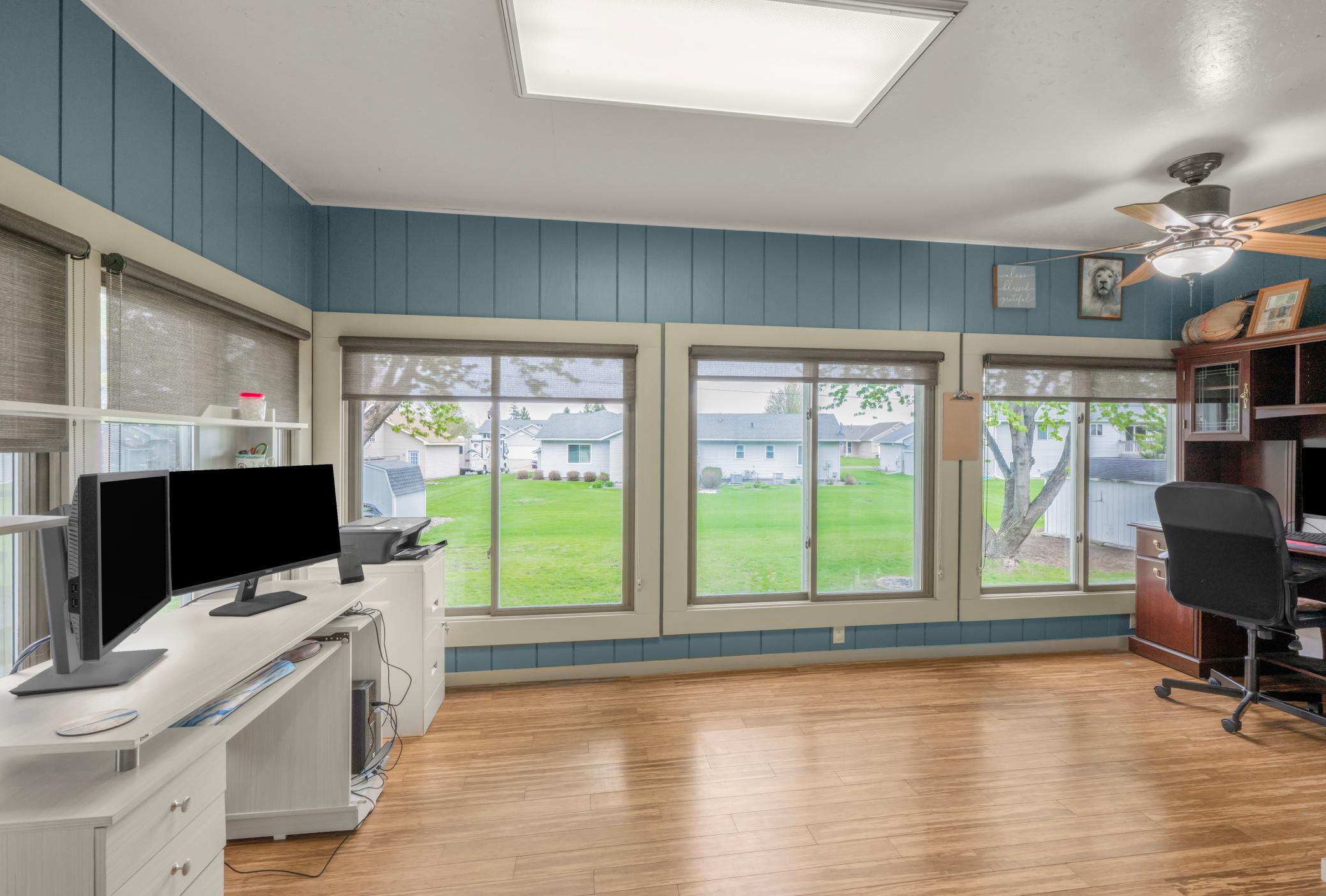 View of the backyard from the sunroom, look at all of the windows and the room has heated floors