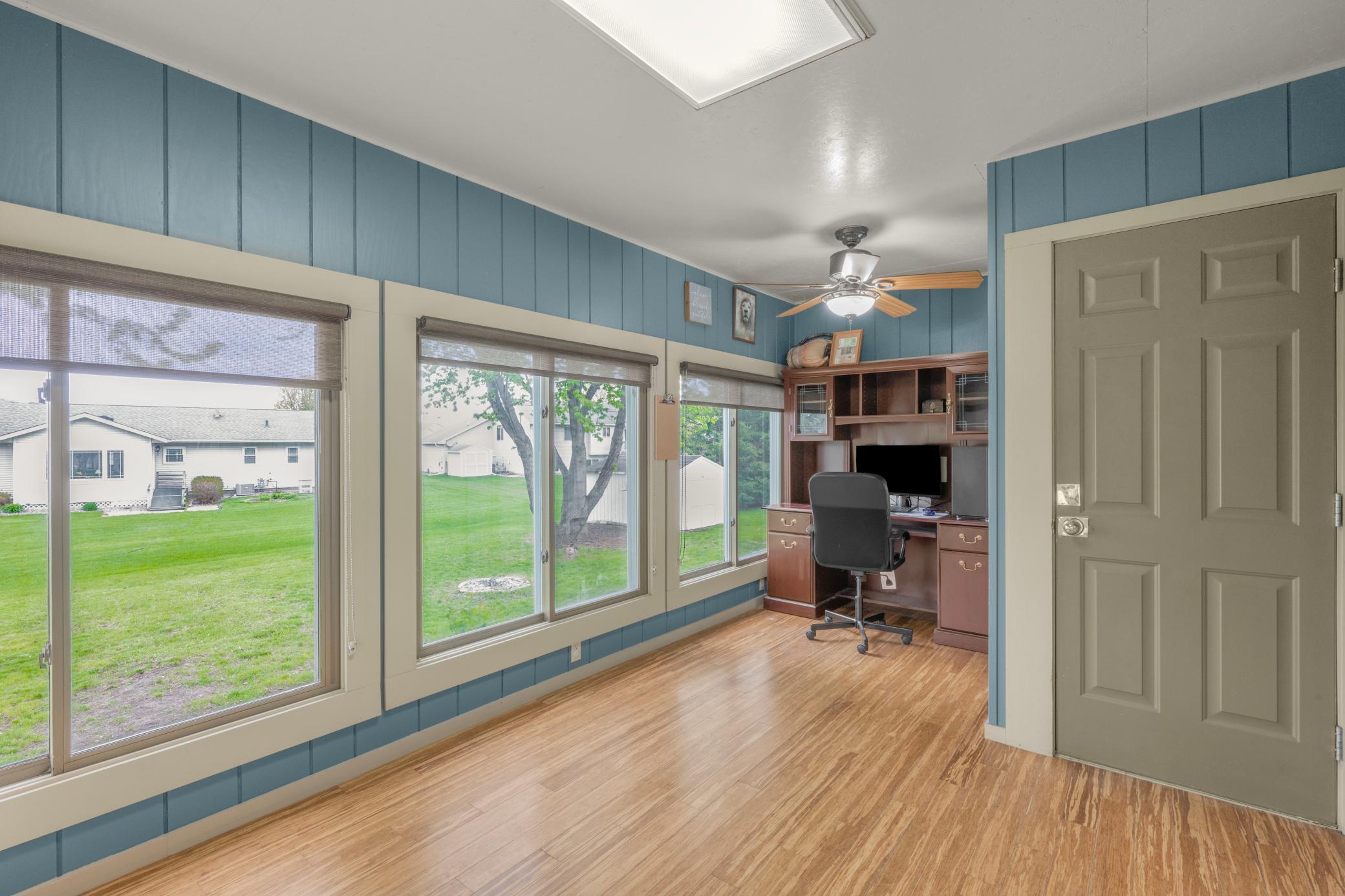 The amazing sunroom currently functions as a home office with 2 separate desk areas