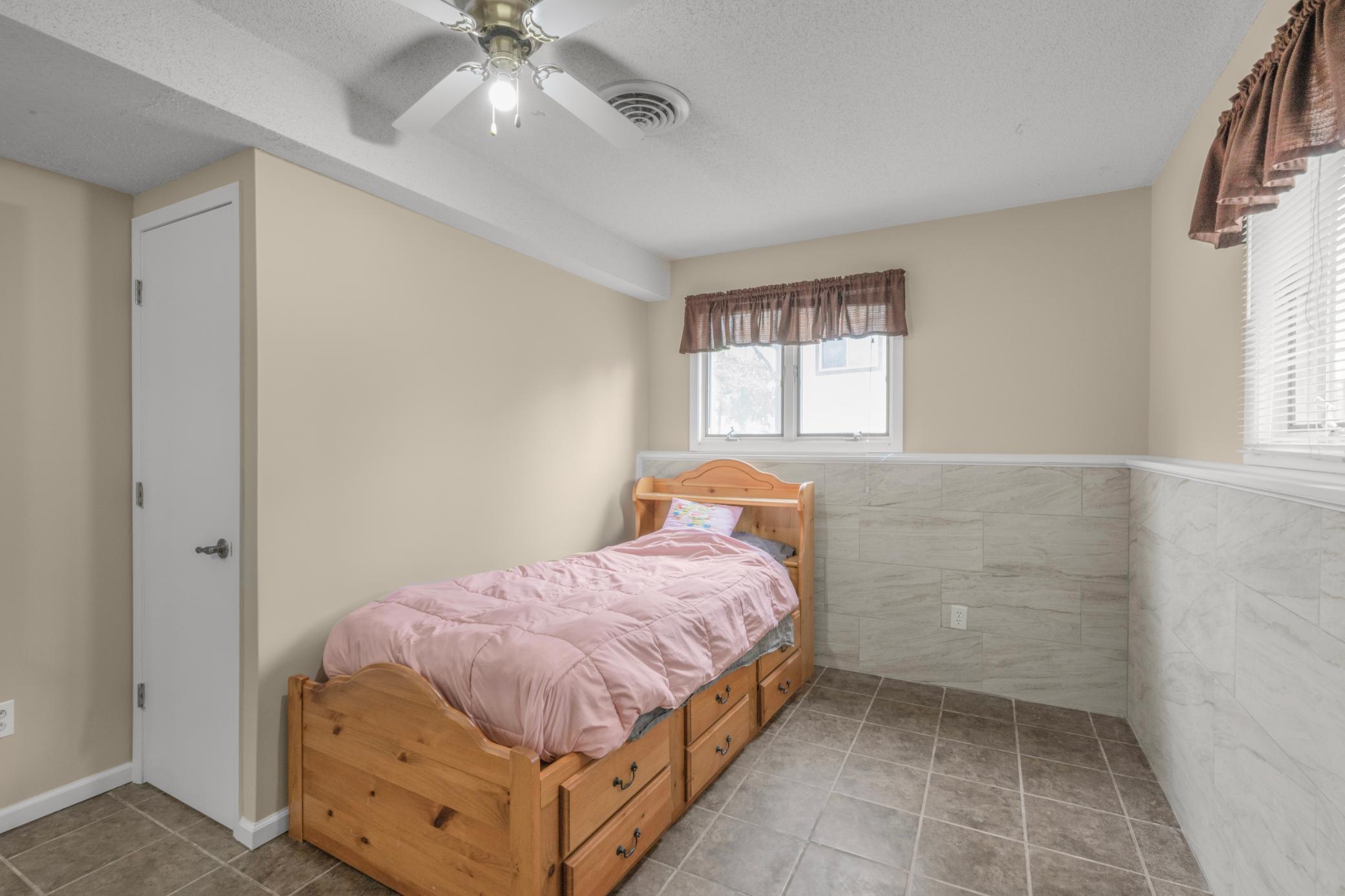 2nd lower level bedroom. Check out the in-floor heat, no cold toes in the winter