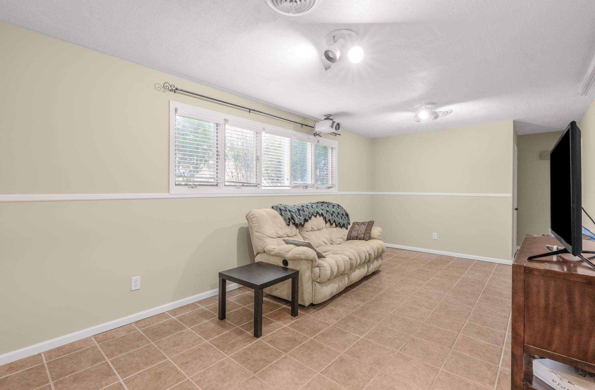 Family room with windows that bring in so much light!