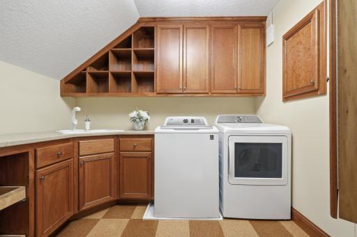 The upper-level laundry area has ample space.