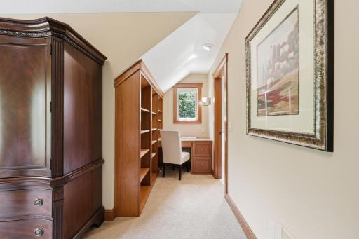 What a darling built-in writing desk and bookshelves.