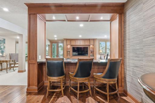 This bar is open to the family room making it a perfect space to host the big game.