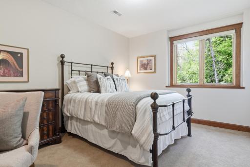 The lower-level bedroom is light, bright and cozy. It is also set back in the floorplan for ultimate privacy.