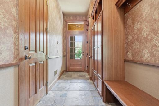 The side entry has a spacious and functional mudroom between the garage and the kitchen.