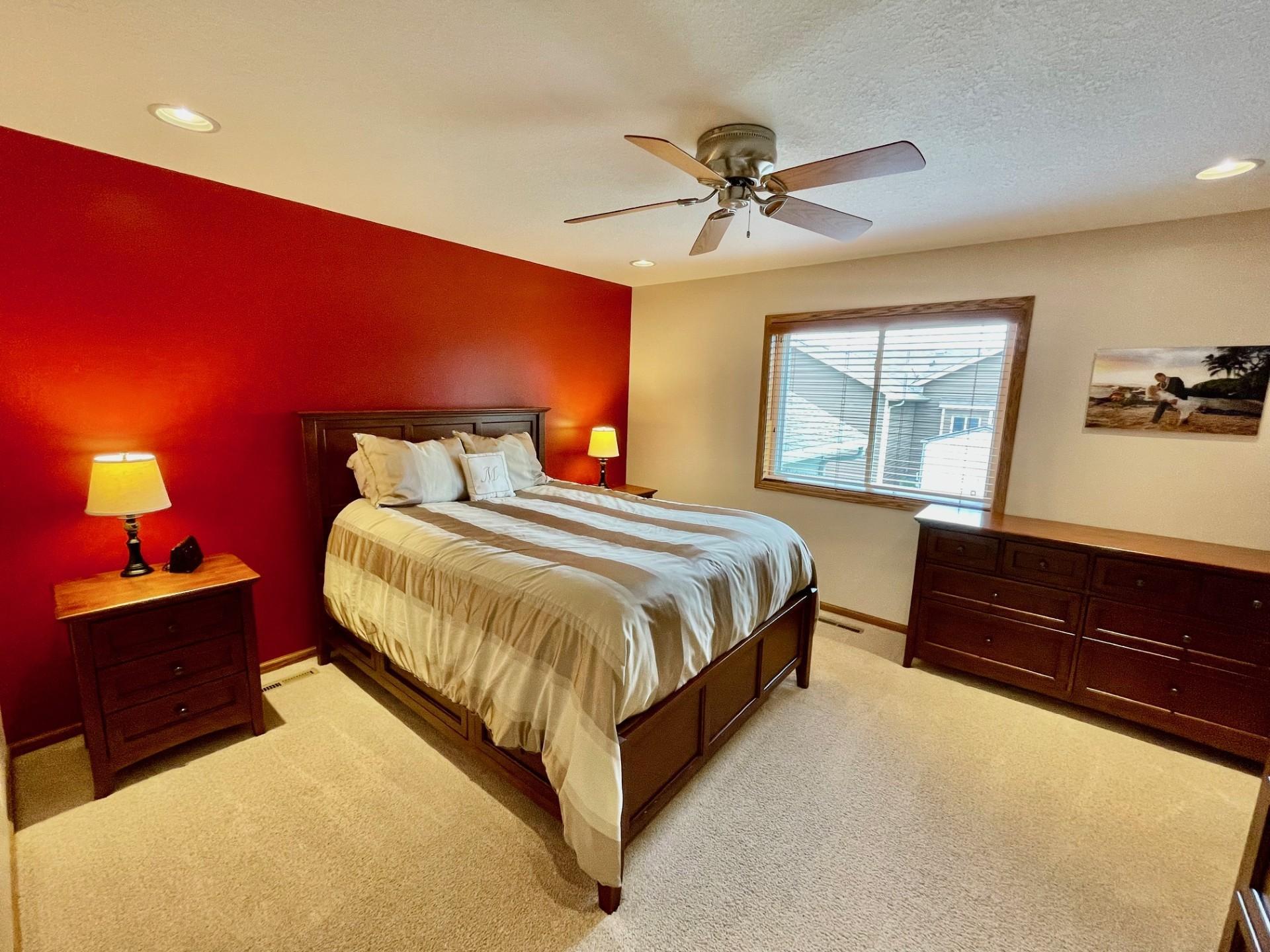 Primary bedroom with walk-in closet and private bathroom access