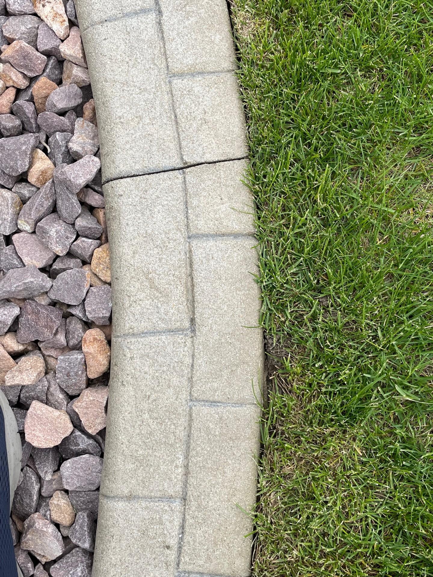 Landscape edging around home allows mowing without the need for separate trimming