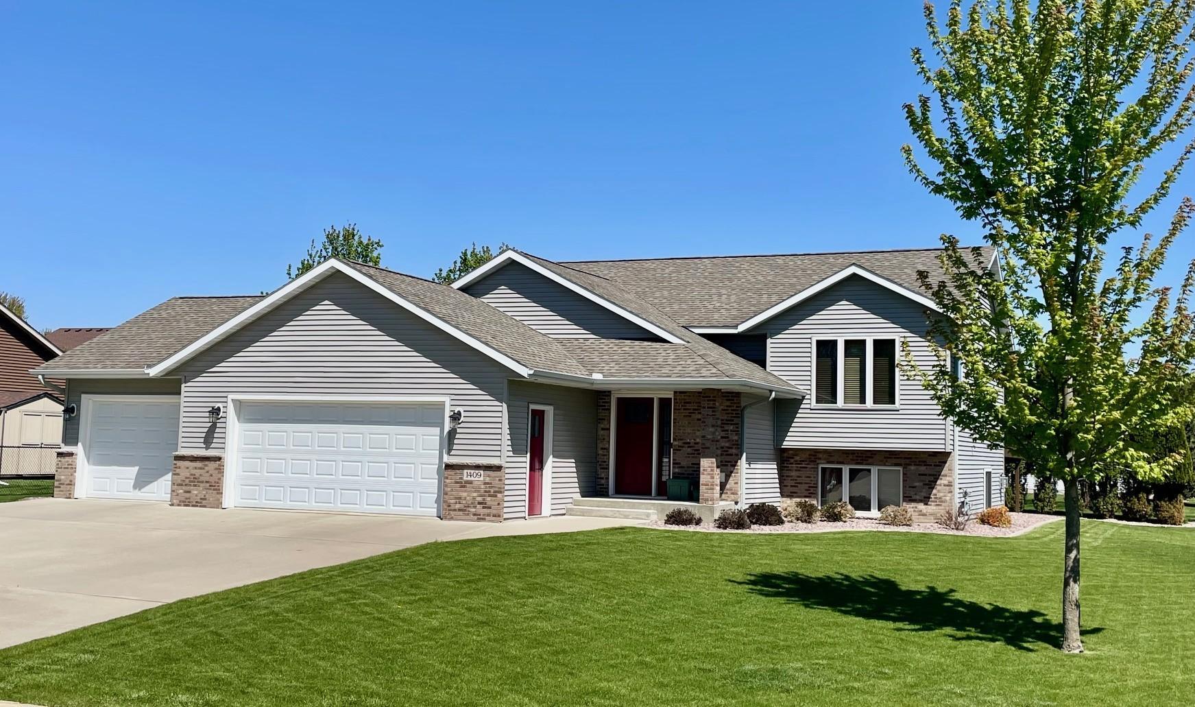 Front of home, beautiful 4 bedroom 2 bath with triple garage