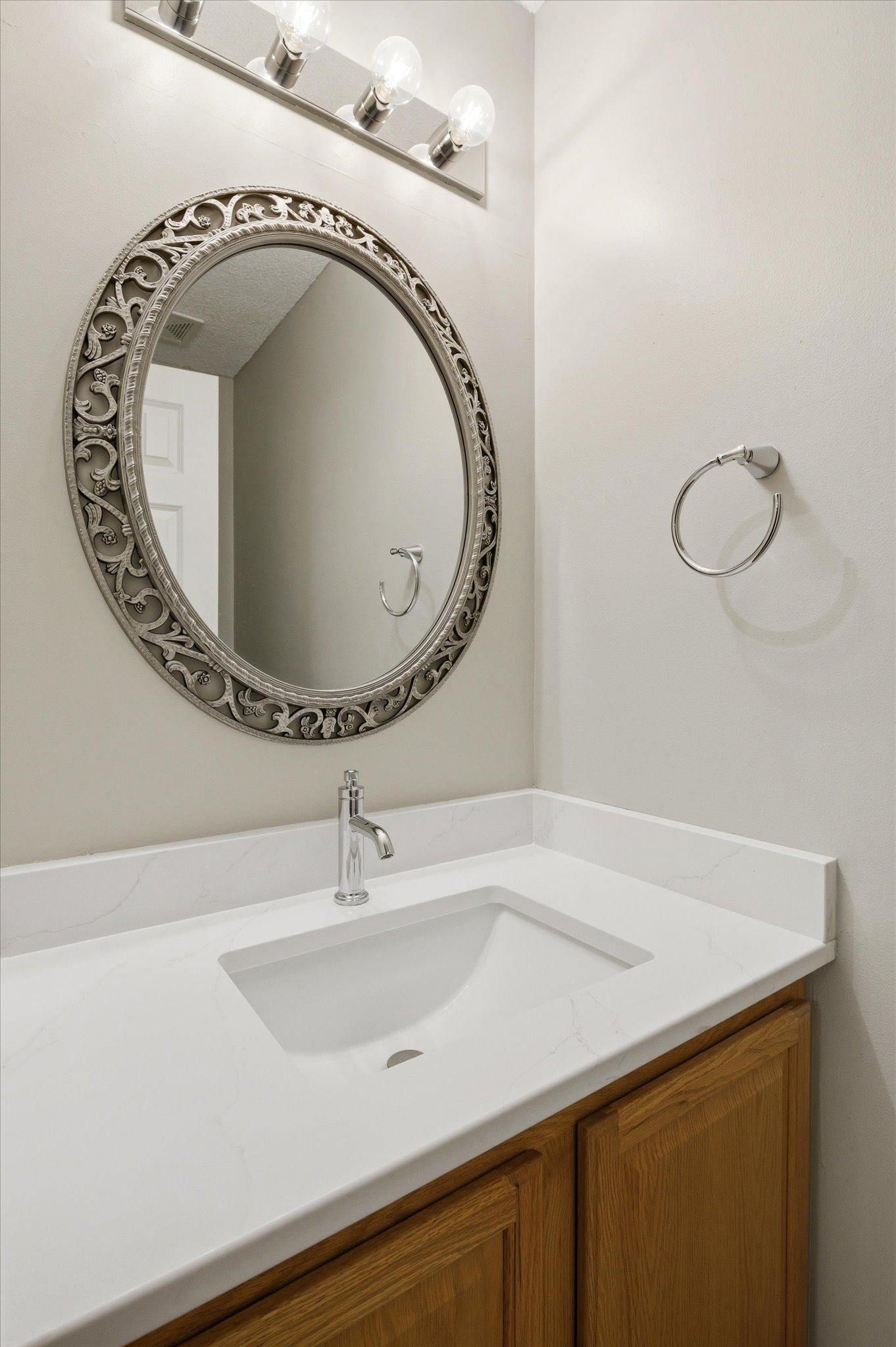 Conveniently located on the main floor, the updated half bathroom adds both style and functionality for guests and daily living.