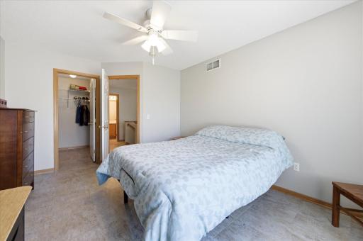The spacious upper-level primary bedroom offers a relaxing retreat complete with a generous walk-in closet.