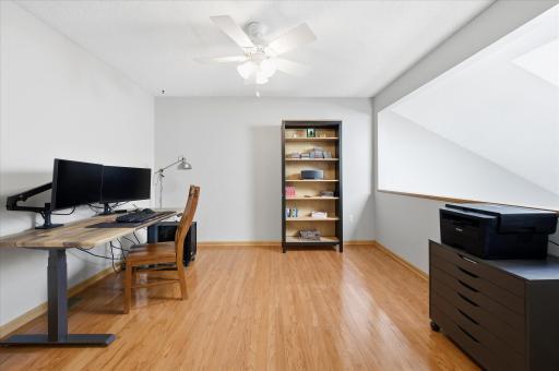 The versatile loft area is currently used as a home office but could easily become a reading nook, media space, workout area, or guest retreat.