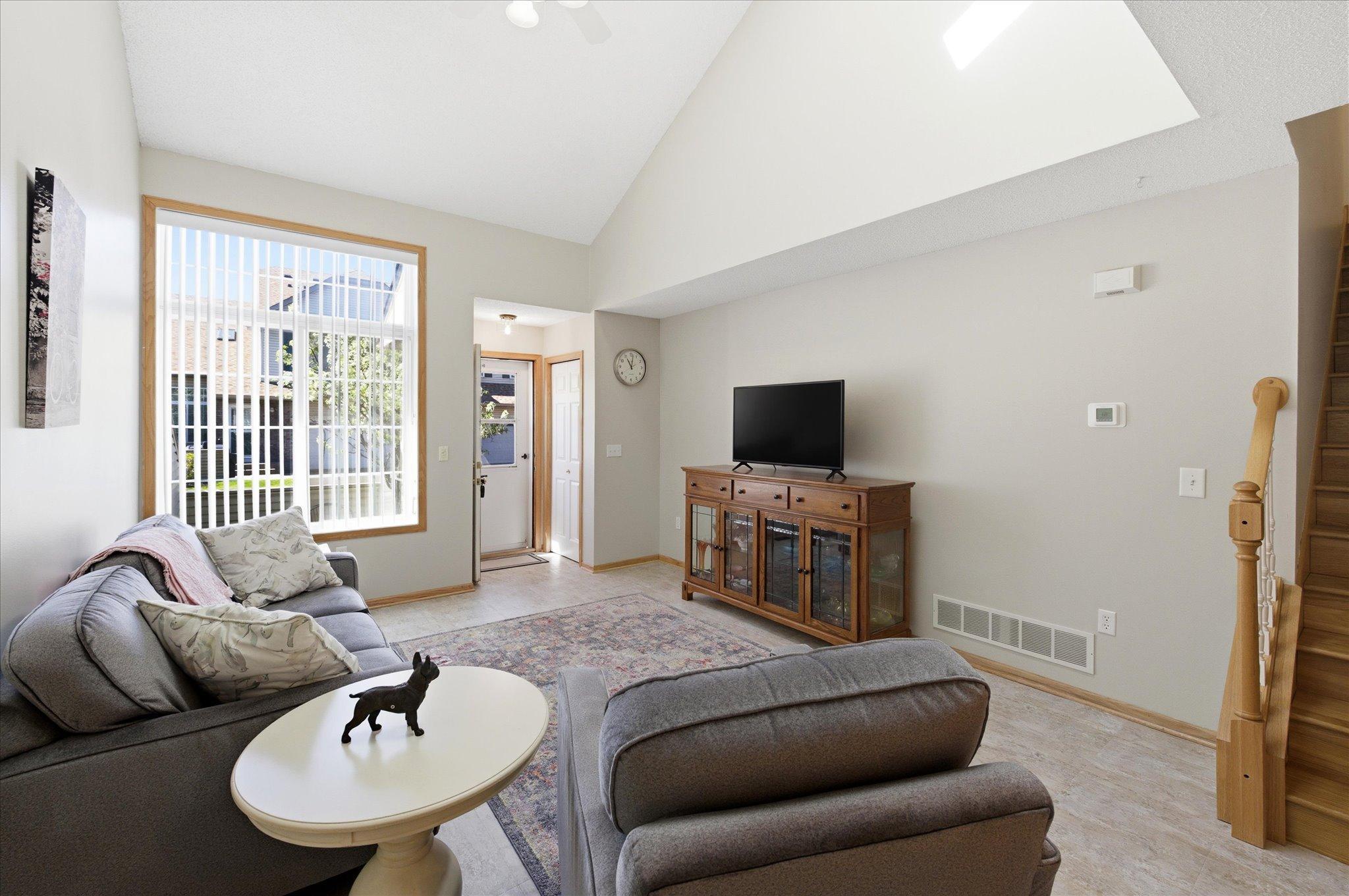 Soaring vaulted ceilings and abundant natural light give this living room an airy, open feel you’ll appreciate every day.