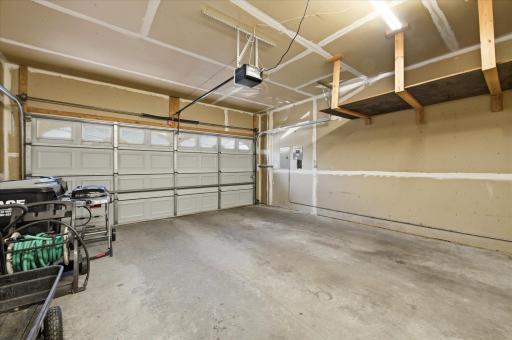 The attached garage offers generous space for vehicles, storage, tools, and outdoor gear.