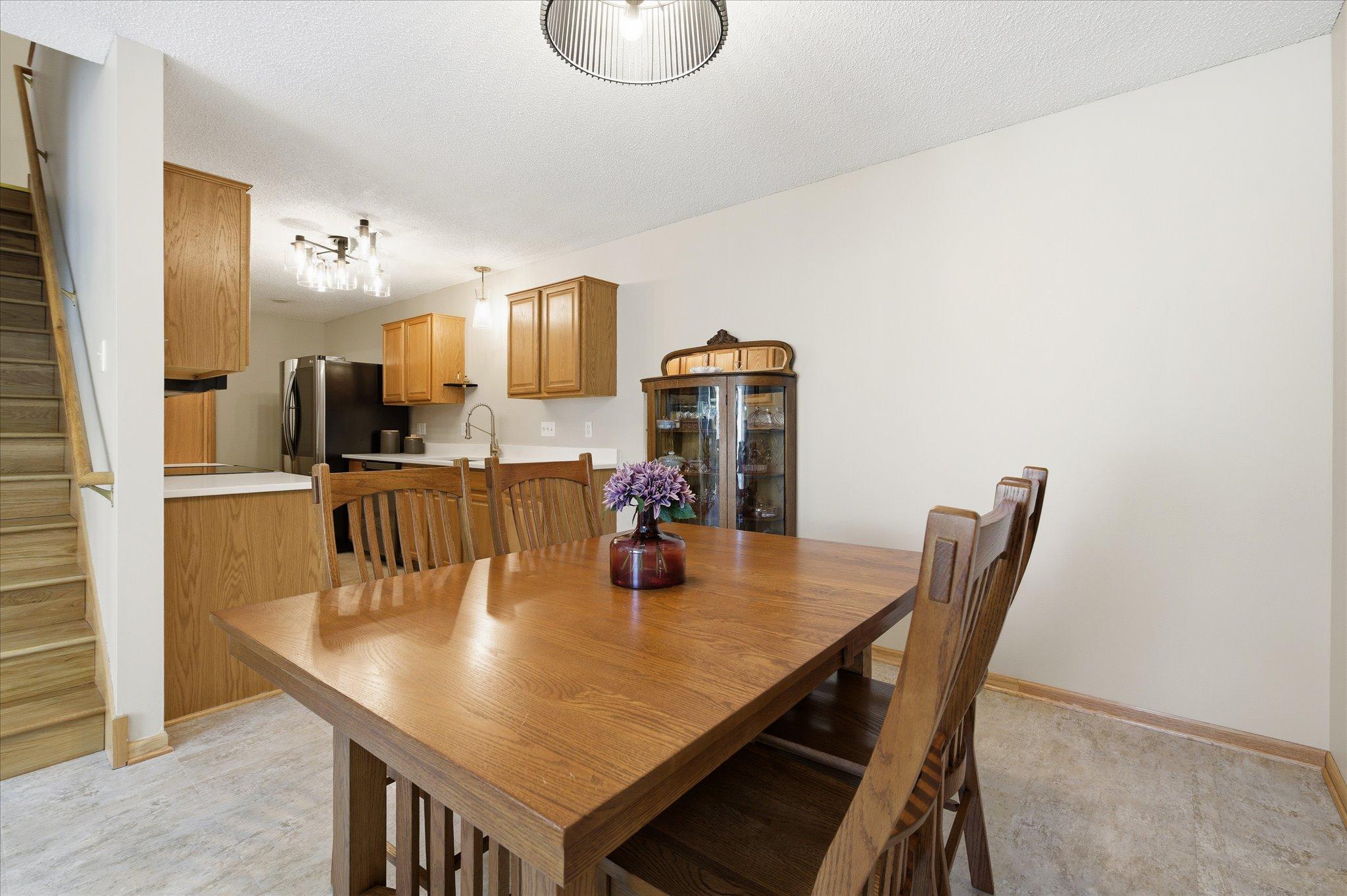 Conveniently located just off the kitchen, the dining area offers a comfortable setting for casual meals, holiday dinners, or entertaining guests.