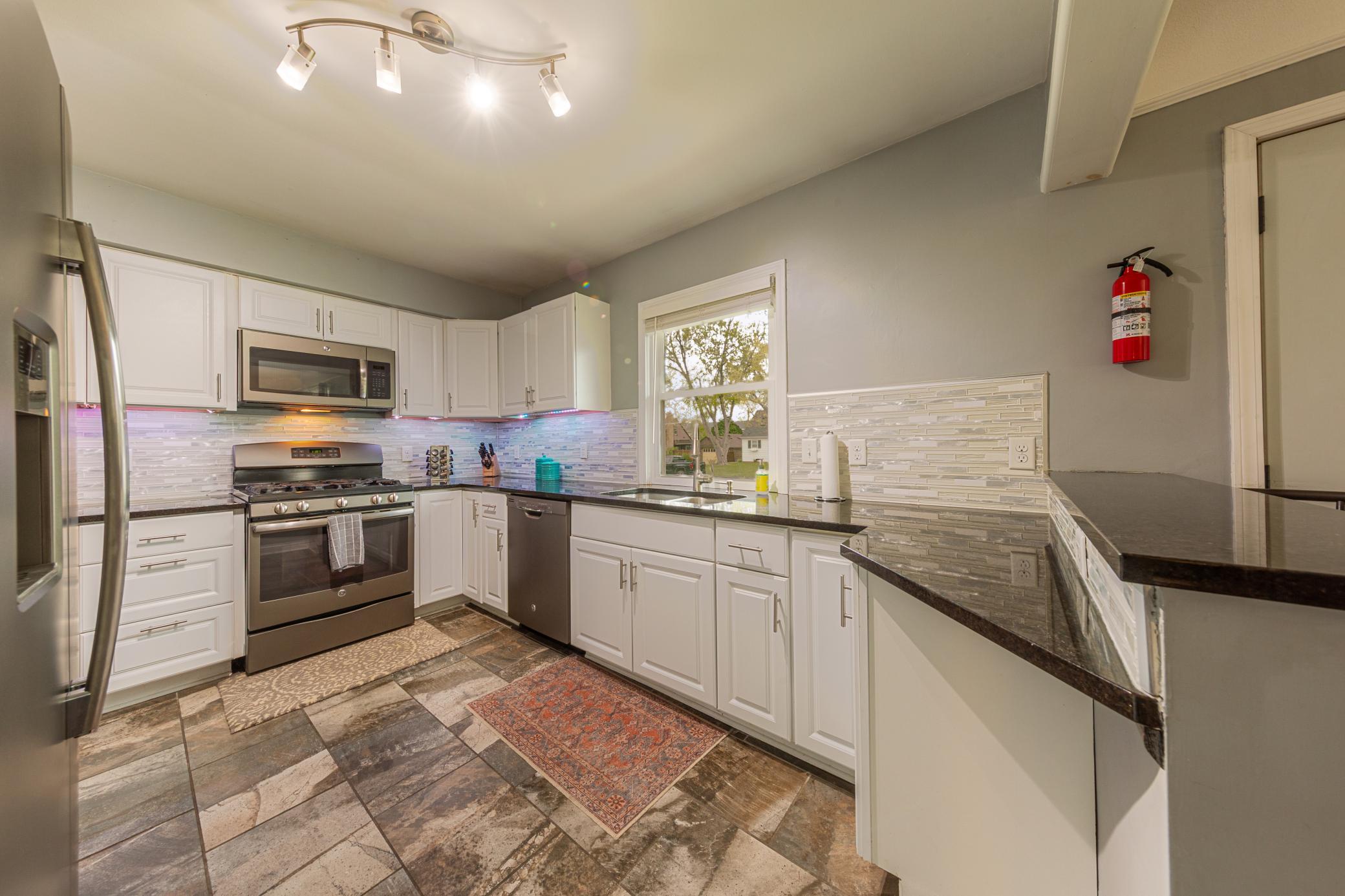 Newer granite countertops, cabinets, and appliances