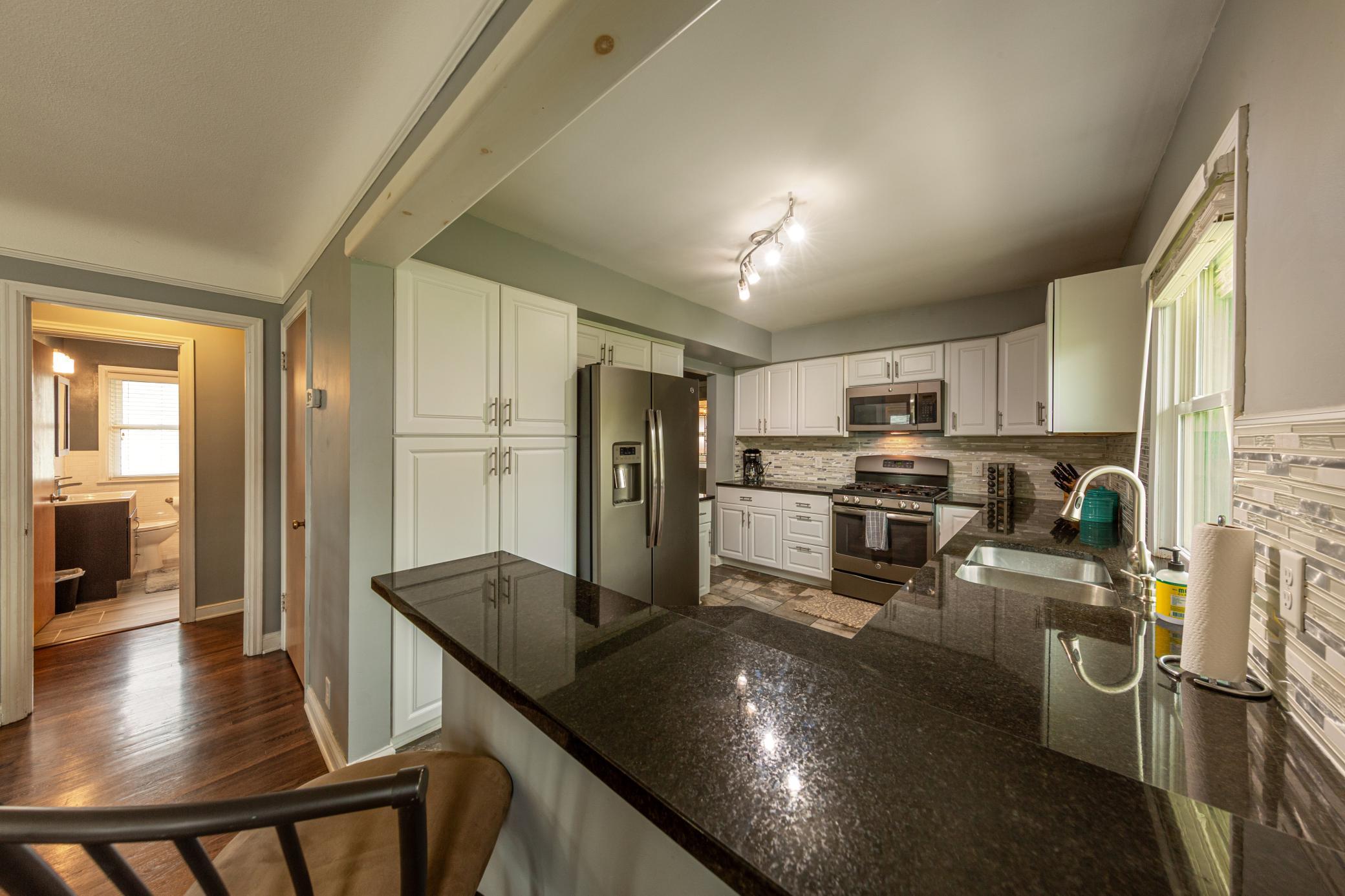 Newer granite countertops, cabinets, and appliances