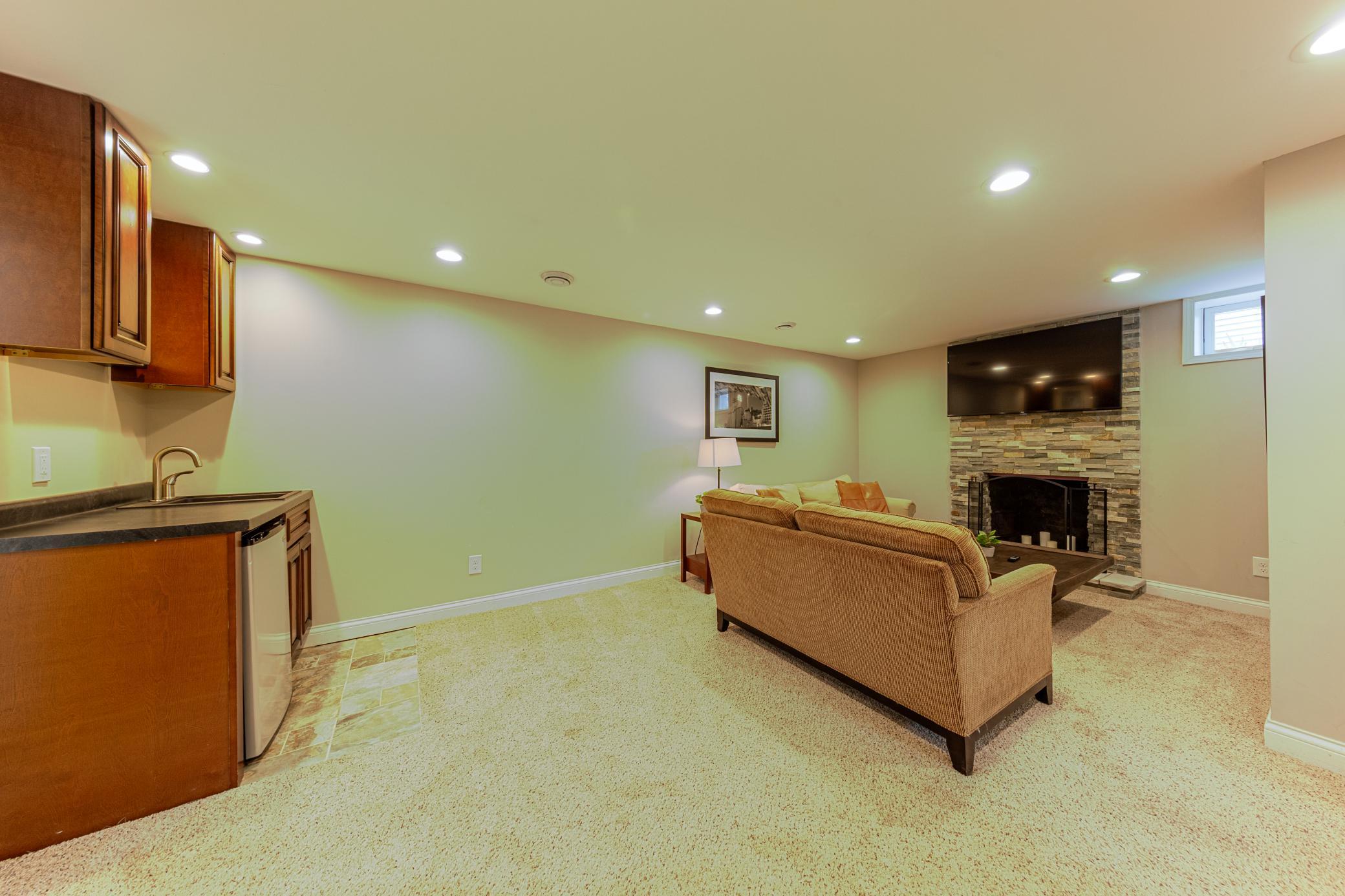 Lower level was finished about 10 years ago and includes a wet bar and wood burning fireplace!