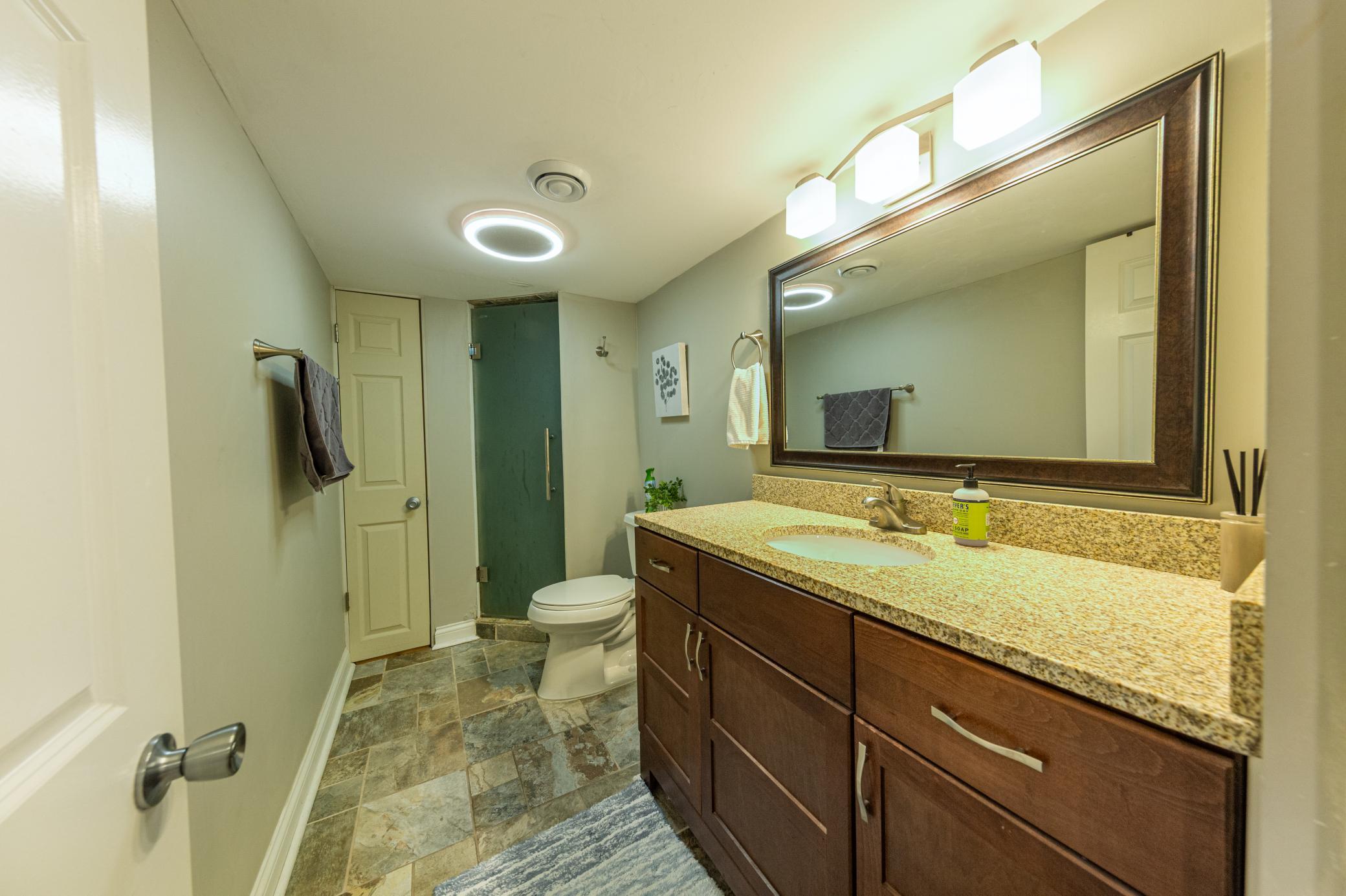 Lower level 3/4 bathroom with larage vanity!