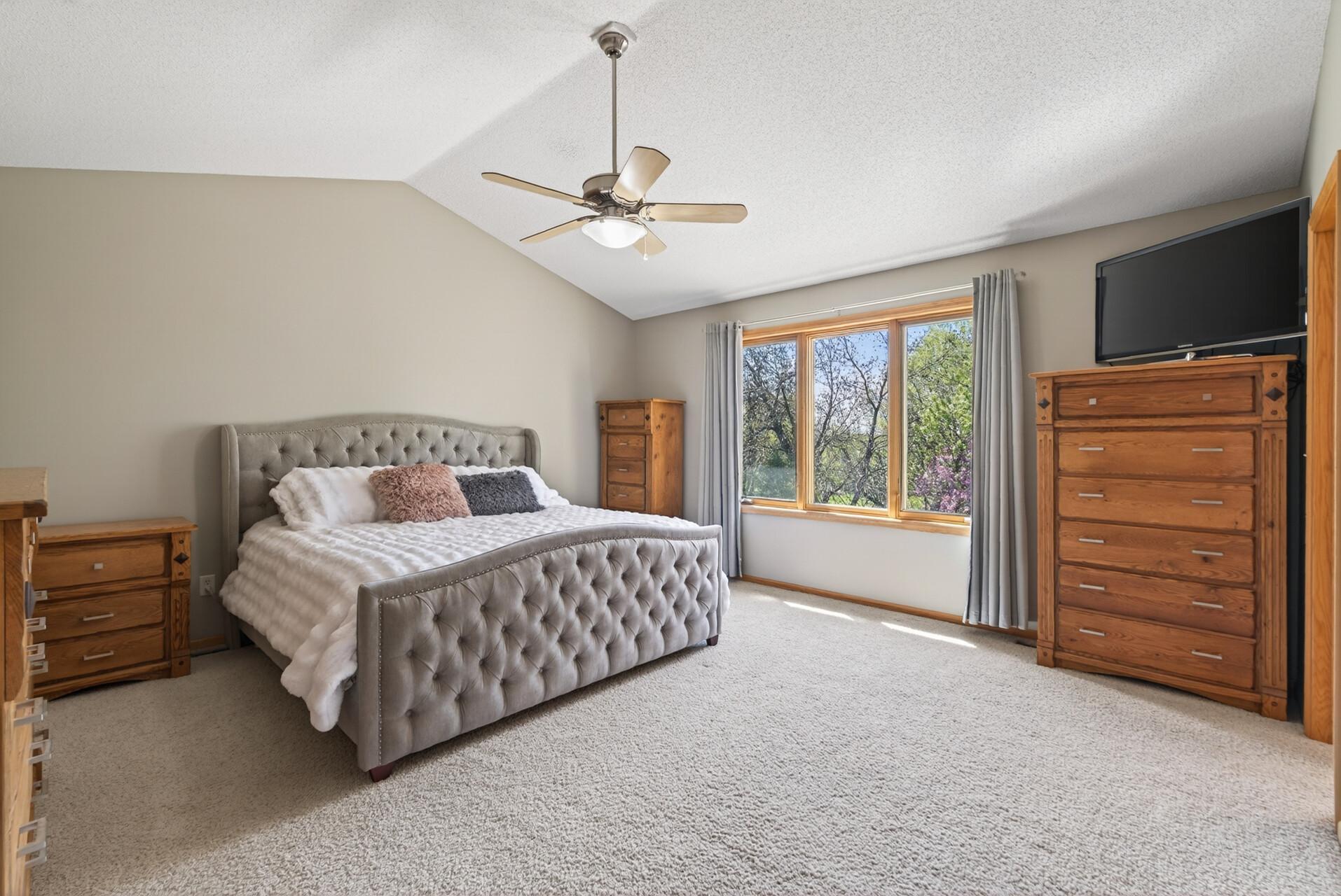 Primary bedroom with backyard views
