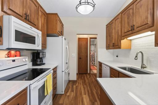 Fresh paint, new light, stone countertops and backsplash!