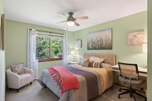 Spacious 2nd bedroom with a large window with views to the pines, so calming!