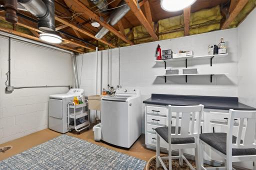 Oversized laundry/mud and craft room. More storage! Utility sink. Folding counter or great spot for all your DIY projects!