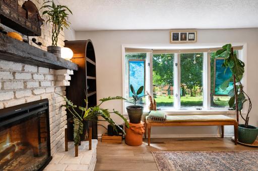 Another shot of the living room with picture-windows to the beautiful backyard.