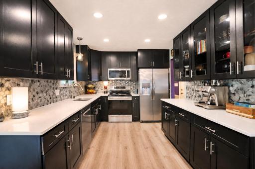 Comfortable workspace. Plenty of cabinets & countertops.