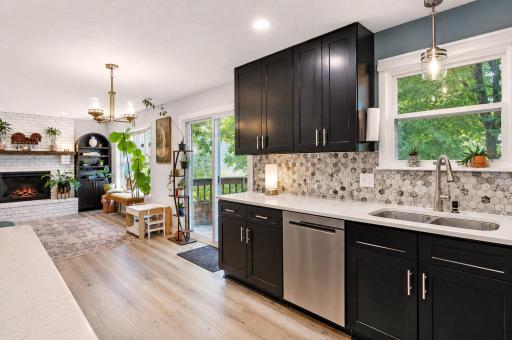 Kitchen adjoins kitchen, with easy access to back-deck through sliding door.