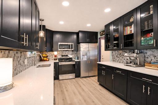 Beautifully updated with wraparound stone-tile backsplash.