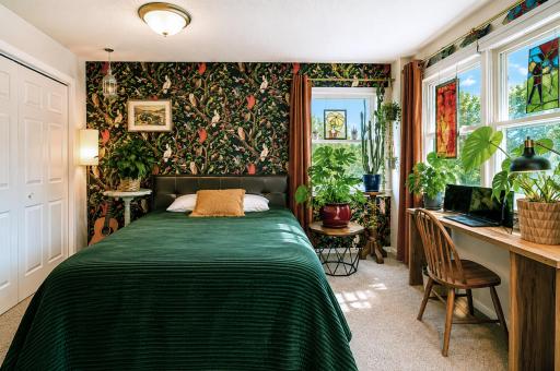 The owner's suite bedroom looks out upon the lovely backyard..jpg