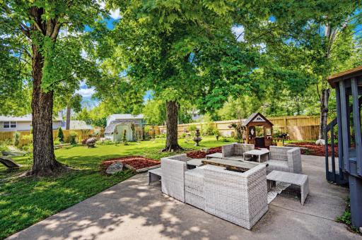 Lots of patio space for entertaining. The best is yet to come ââ as this backyard explodes with blooms once the Summer's fully underway!